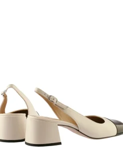 Leren slingpumps crème/zwart