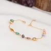 Vergulde armband met edelstenen en parels